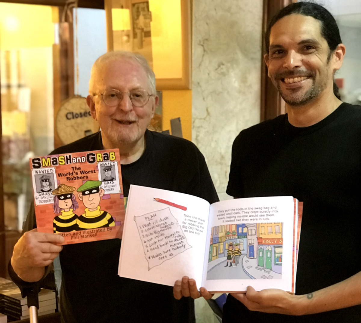 Writer and illustrator Phil Mansell with Sam Moustafa, owner of Polly's Bookshop.